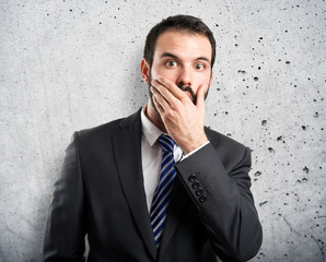 Businessman surprised over white background