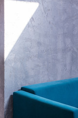 Turquoise sofa in empty interior