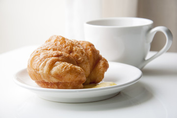 Croissant and cup of coffee