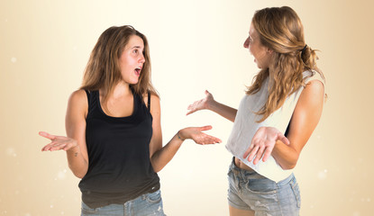 Two girls doing surprise gesture
