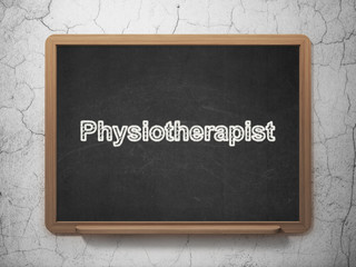 Health concept: Physiotherapist on chalkboard background