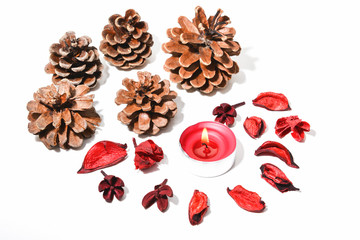 Christmas background with fir cones and red candle