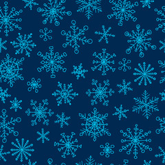 Naklejka na ściany i meble Seamless pattern with hand drawn doodle snowflake. Vector winter pattern. Blue snowflakes on dark background.