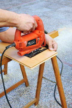 Carpenter working with jig saw