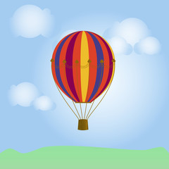 Obraz premium jasny. kolorowy balon na gorące powietrze w błękitne niebo z chmurami