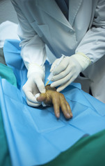 Surgeon doctor injecting patient in hospital clinic