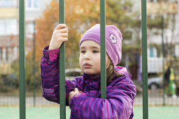 Sad child in jail
