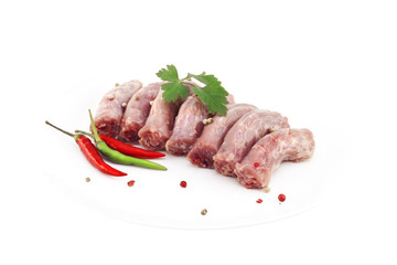 Куриные шеи с перцем на белом фоне