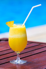 Fresh pineapple juice cocktail near the pool