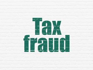 Law concept: Tax Fraud on wall background