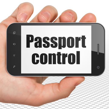 Vacation concept: Hand Holding Smartphone with Passport Control on display