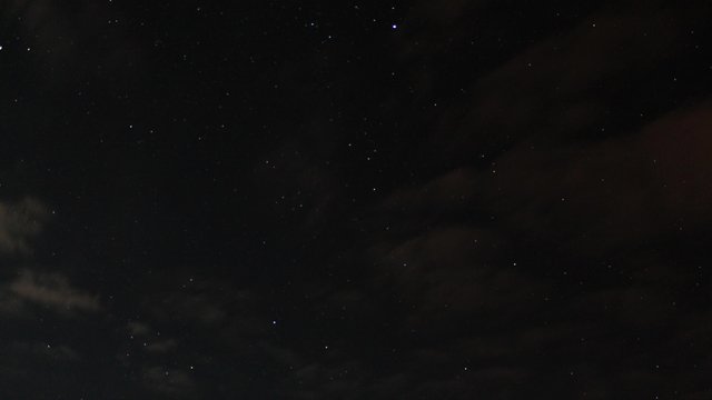 timelapse clouds on a background the starry sky