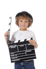 Fototapeta premium enfant garçon 6 ans tenant clap de cinéma
