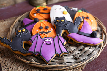 Fototapeta premium Halloween cookies on wattled plate