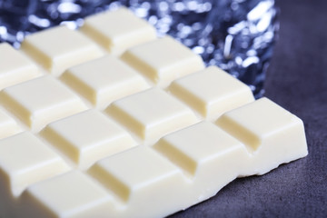 White Chocolate bar in foil, close-up