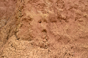 Closeup of bright orange sand formation of Tatacoa desert - natural background 