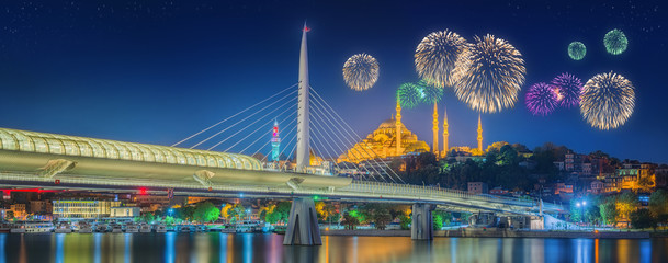 Obraz premium Ataturk bridge, metro bridge and beautiful fireworks, Istanbul