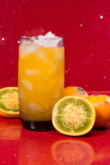 Lulo delicious juice on red background