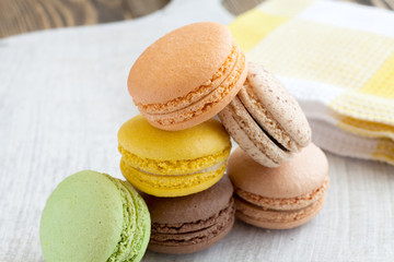 colored macaroon on a wooden background
