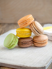 colored macaroon on a wooden background