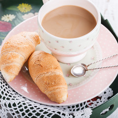 Croissants and coffee with milk and sugar by Breakfast.selective focus.