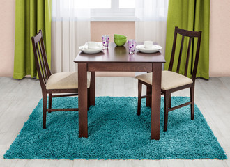 Simple wooden dinning table and chairs in interior - studio ambi