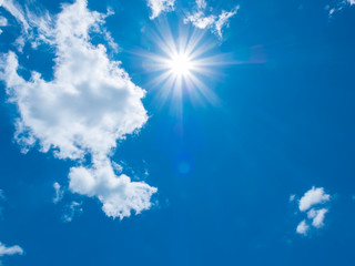 Naklejka na ściany i meble Blue sky clouds with sun beams light (copy space)
