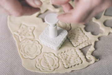 woman making ginger bread cookies in the kitchen