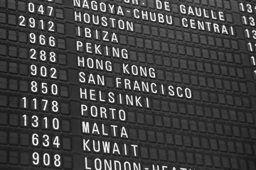 flights information board in airport terminal