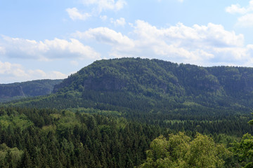 Fototapeta na wymiar Panorama with mountain Kleiner Winterberg and forest seen from Kuhstall in Saxon Switzerland