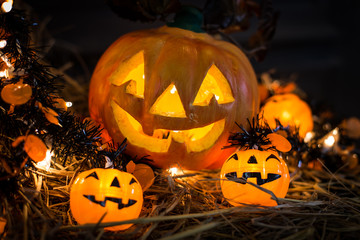 Selected focus Halloween pumpkin with candlelight and skull with