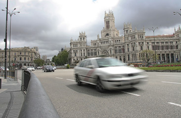 Taxi crossing the Plaza de Cibeles in Madrid