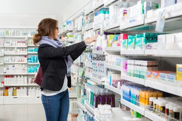 Peel and stick wall murals Pharmacy Female Customer Choosing Product At Pharmacy