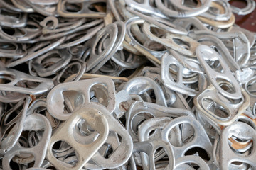 used aluminum can openers on wooden table