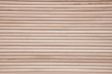 Wooden stakes in rows as background