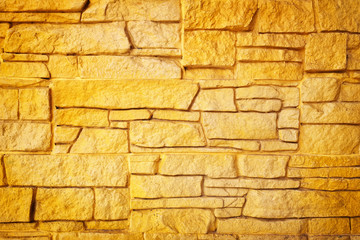 Golden stone wall background. brick wall background.