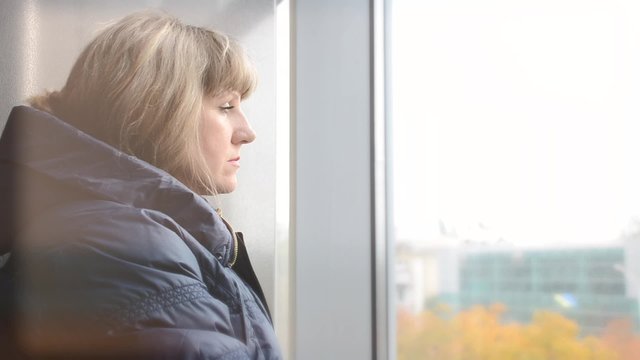 A woman looking out the window.