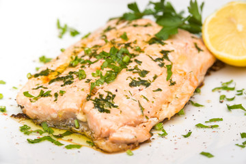 Poached salmon with extra virgin olive oil and parsley 