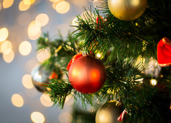 close up of christmas tree decorated with balls
