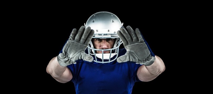 Composite image of portrait american football player defending