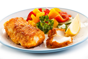 Fish dish - fried fish fillets and vegetables 