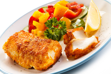 Fish dish - fried fish fillets and vegetables 