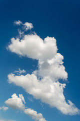 white cumulus clouds in the blue sky