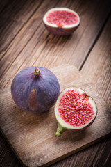 Sliced figs on a wooden table.