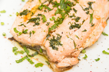 Poached salmon with extra virgin olive oil and parsley 