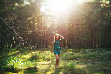 redhead girl in the forest