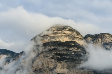 ancient mountain peaks enveloped in clouds