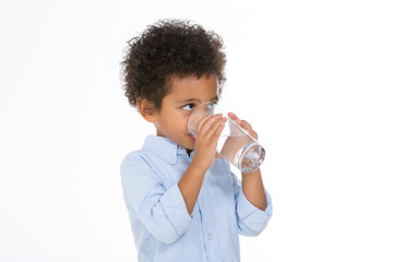 pretty little boy drinking water