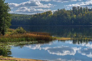 colors surround a small lake near Round Pond