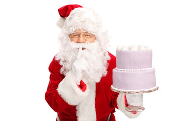 Santa Claus carrying a big cake